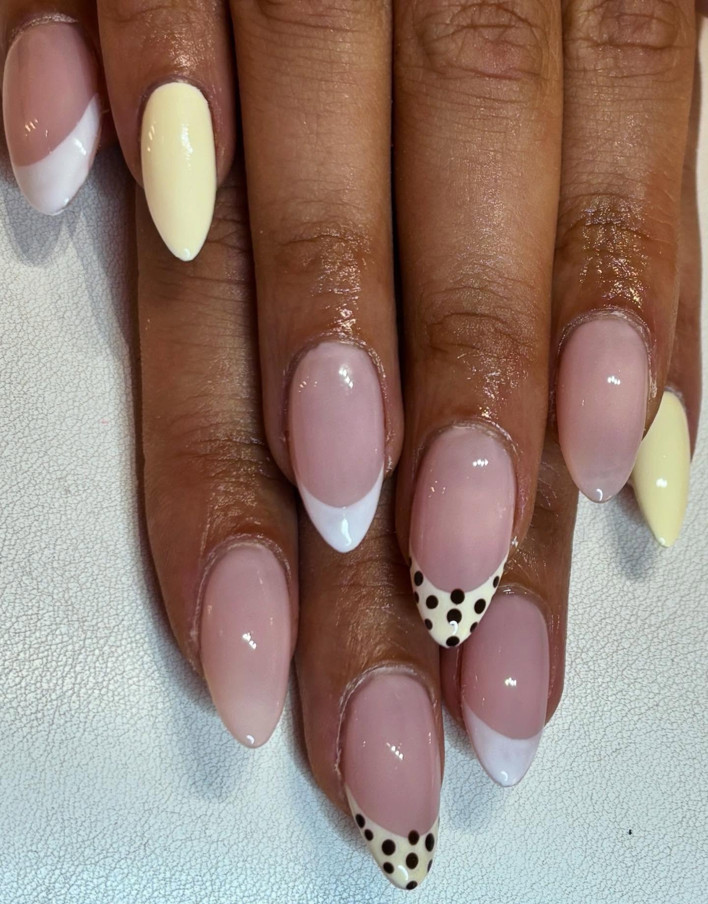 Soft glam with a playful twist 🤍✨
Classic French tips meet creamy vanilla accents and chic polka dots… because neutrals don’t have to be boring 💅🏽

Clean, classy, and just a little bit fun — the pe